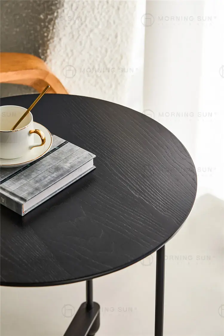 Black round tray table top detail with wood grain texture