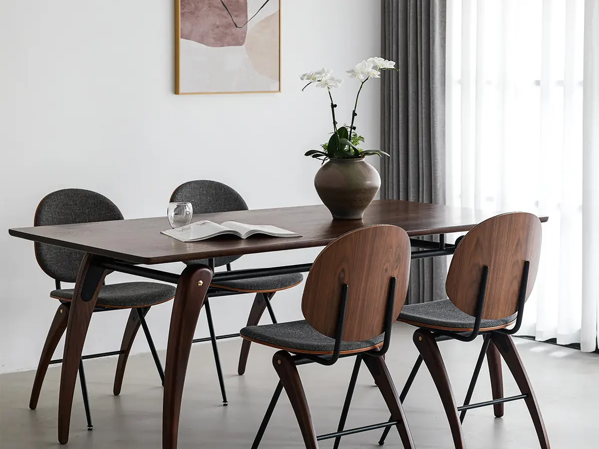 curved wood leg dining table with matching wooden chairs