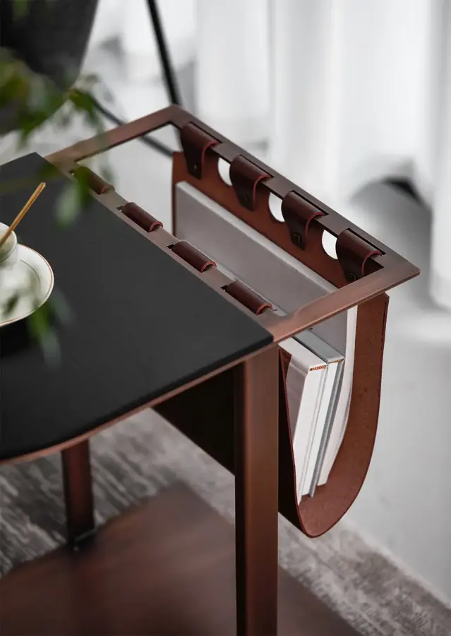 Close up of side table leather sling storage and tabletop structure