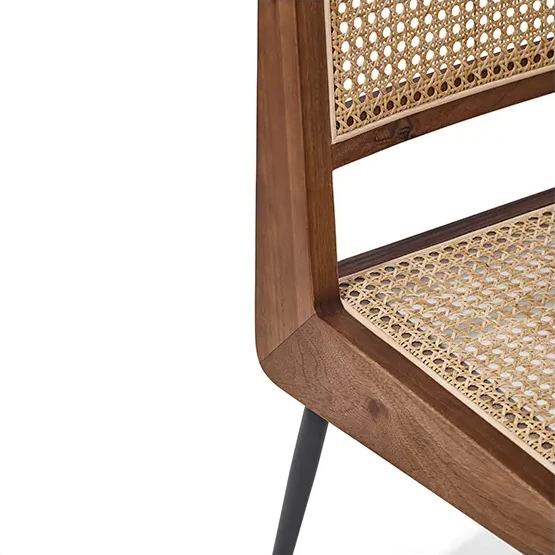Close-up of the natural cane back and wooden frame of the CR215 dining chair