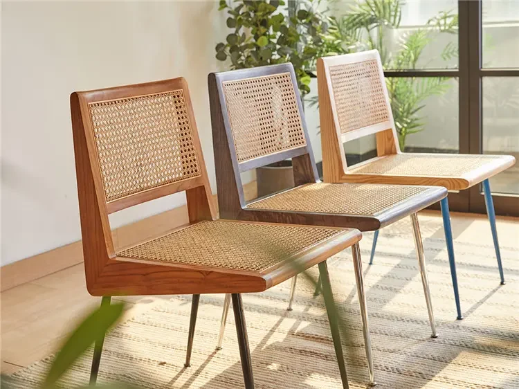 Cane dining chairs shown in different wood and metal finish combinations