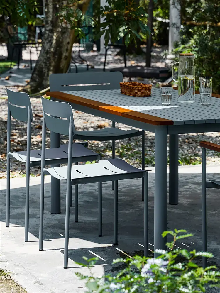 Several MD308 gray metal dining chairs arranged around a dining table