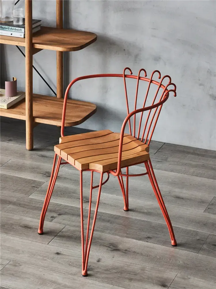 Close interior view of TF524 terracotta chair with slatted seat and fan-shaped back