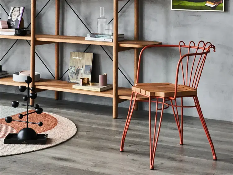 Three-quarter interior view of TF524 terracotta metal frame dining chair