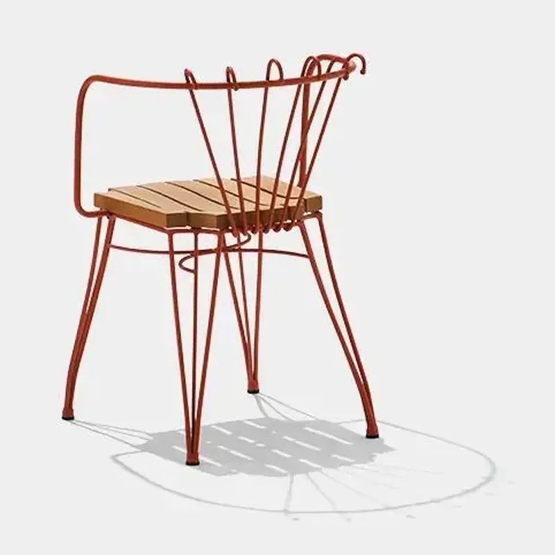 Rear three-quarter view of TF524 chair showing fan-shaped metal back