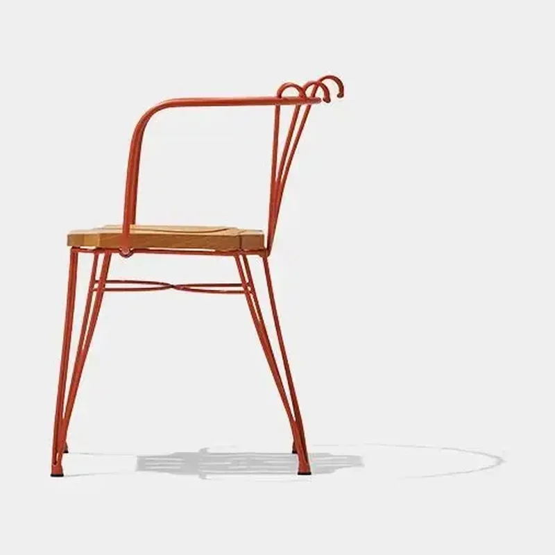 Side view of TF524 dining chair showing integrated arm and metal frame